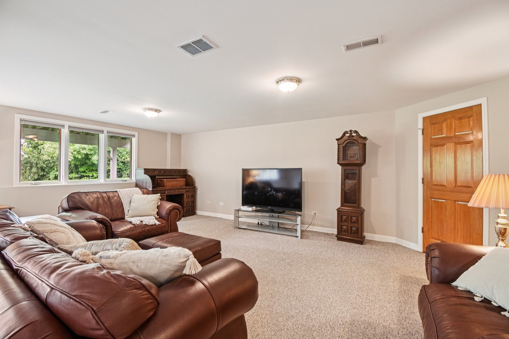 4N466 Mark Twain Street St. Charles, IL 60175 - Photo 25 of 36 a living room with furniture a flat screen tv and a window