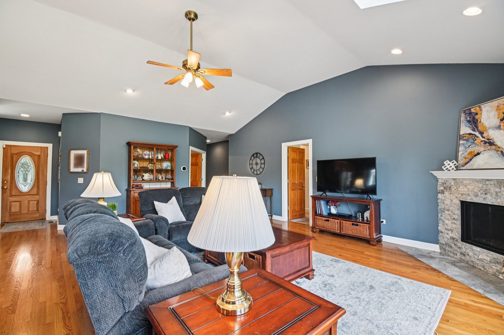 4N466 Mark Twain Street St. Charles, IL 60175 - Photo 8 of 36 a living room with furniture a flat screen tv and a fireplace