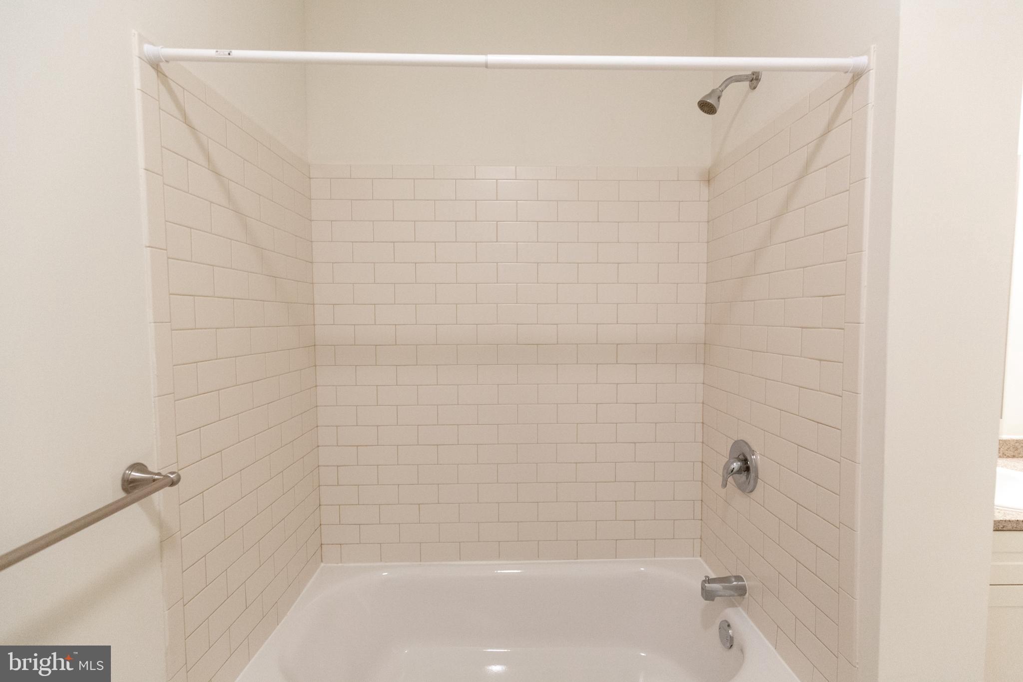 1411-6 Walnut Street, Unit 310 Philadelphia, PA 19102 - Photo 24 of 27 a bathroom with a shower and a shower