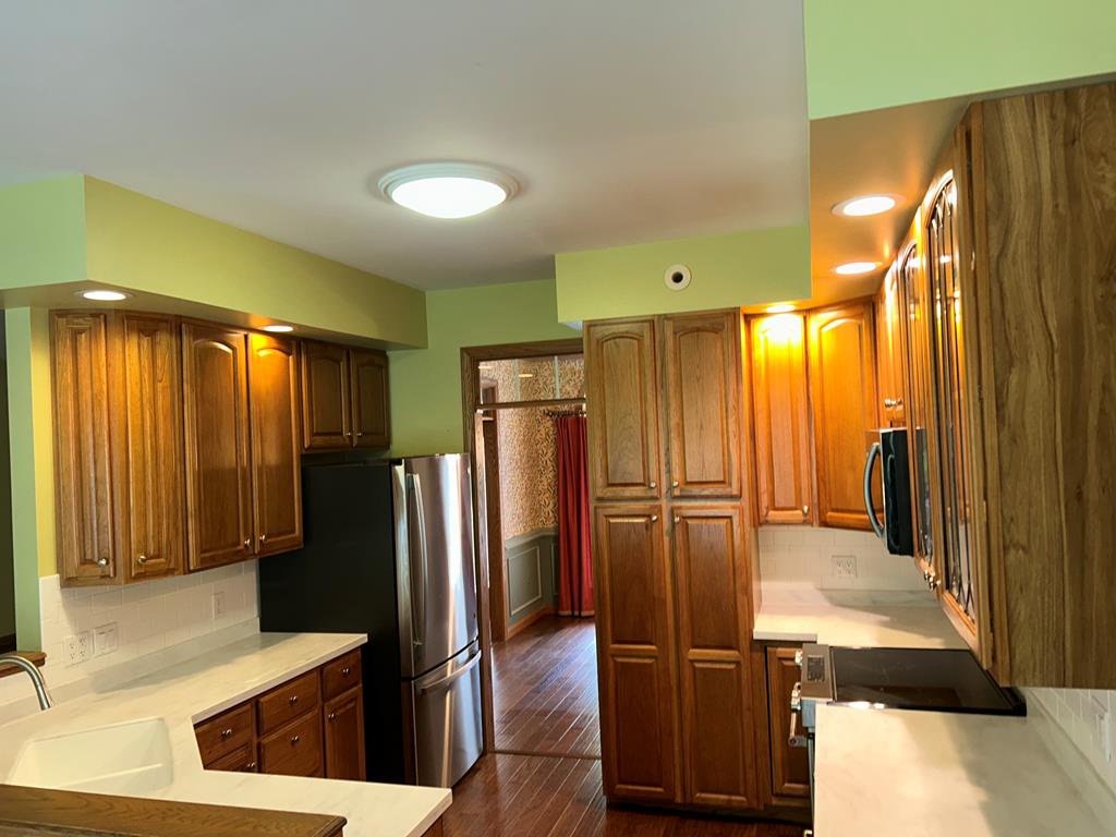 114 Oak Ridge Drive Clarion, PA 16214 - Photo 6 of 38 a kitchen with stainless steel appliances granite countertop a refrigerator and a sink