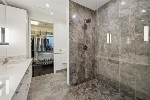a en suite bathroom with a sink and a mirror