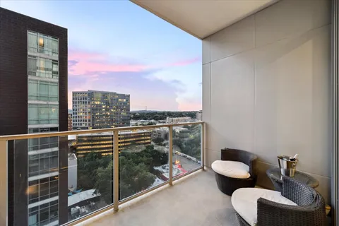 a view of a balcony filled with furniture