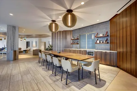 a view of a patio with couches and pool