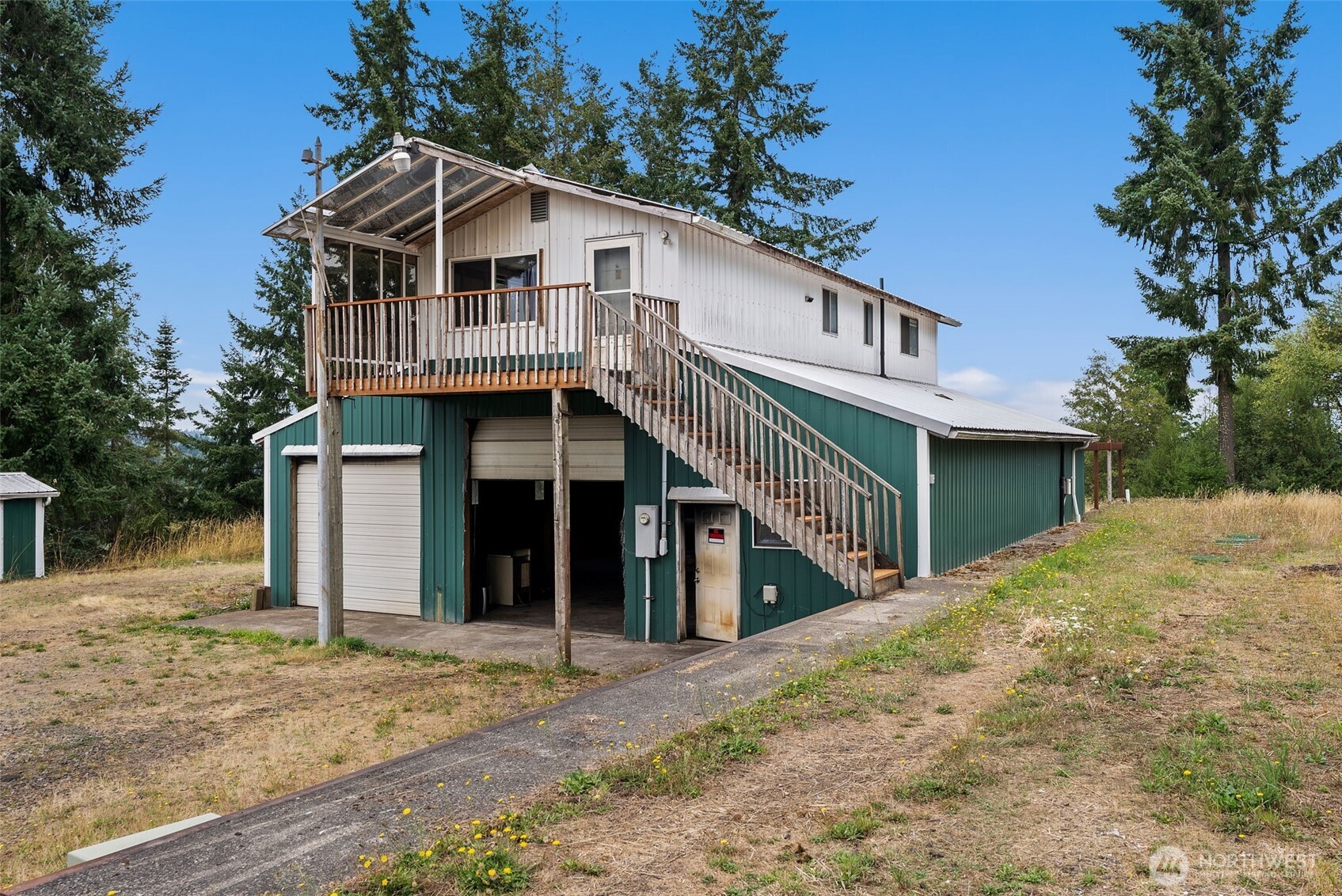 207 Ramsaur Road, Unit E Centralia, WA 98531 - Photo 13 of 21 a front view of a house with a yard and garage