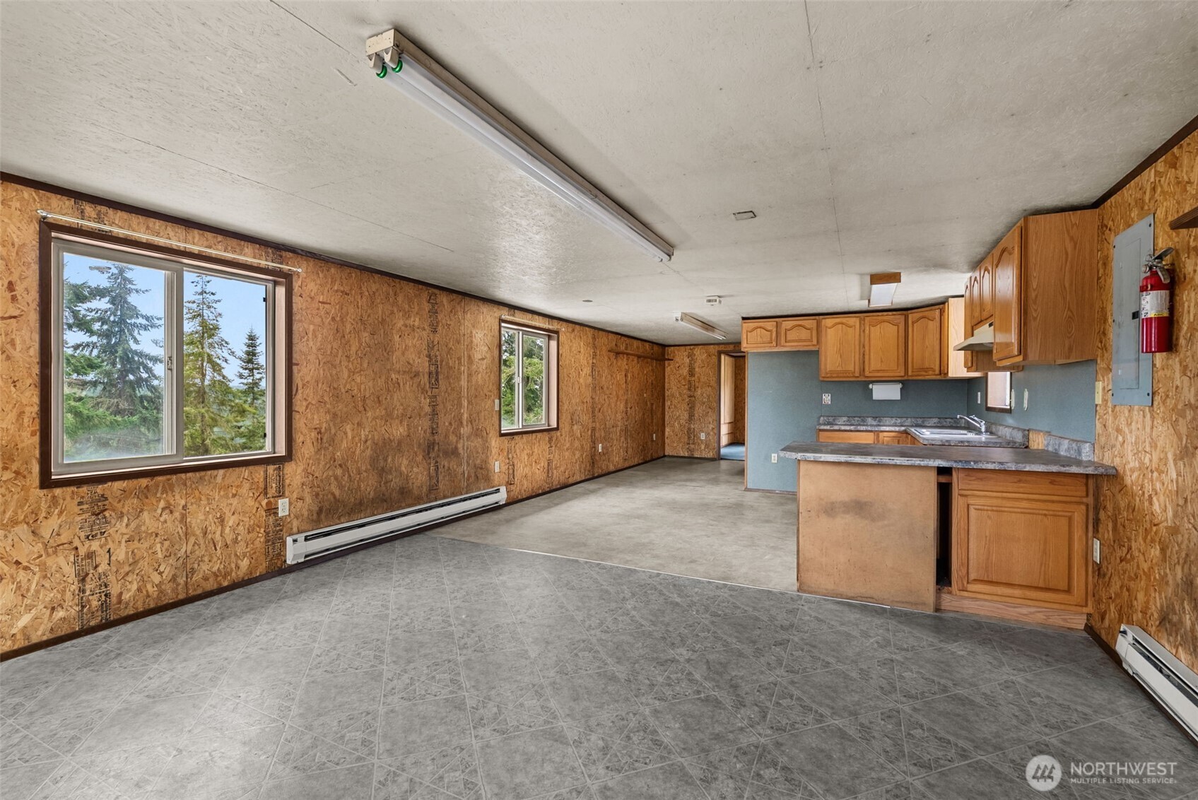 207 Ramsaur Road, Unit E Centralia, WA 98531 - Photo 14 of 21 a view of a kitchen with a sink and dishwasher a large window