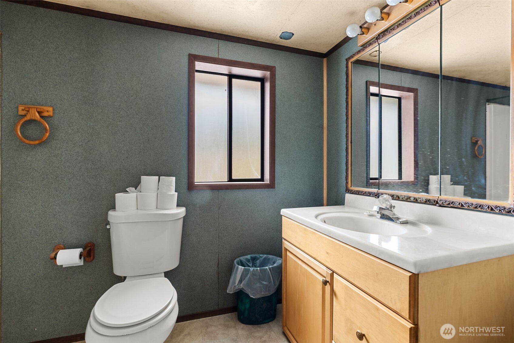 207 Ramsaur Road, Unit E Centralia, WA 98531 - Photo 17 of 21 a bathroom with a toilet sink and mirror
