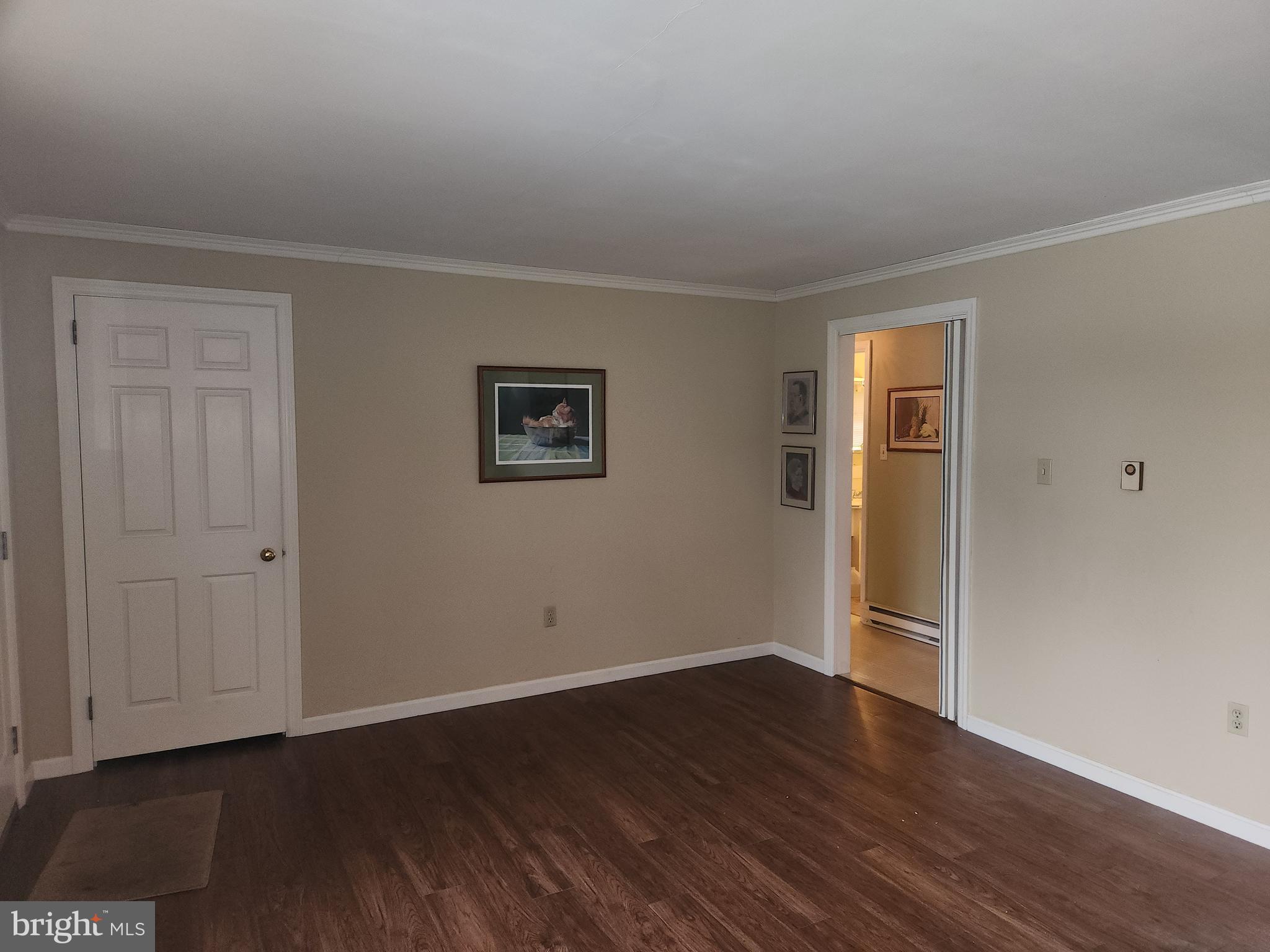 2707 Kimberly Road Lancaster, PA 17603 - Photo 9 of 17 a view of an empty room with wooden floor and closet