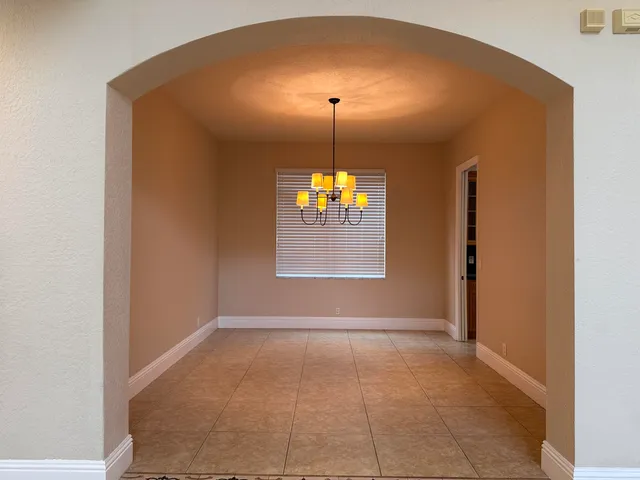 a white toilet sitting next to a shower