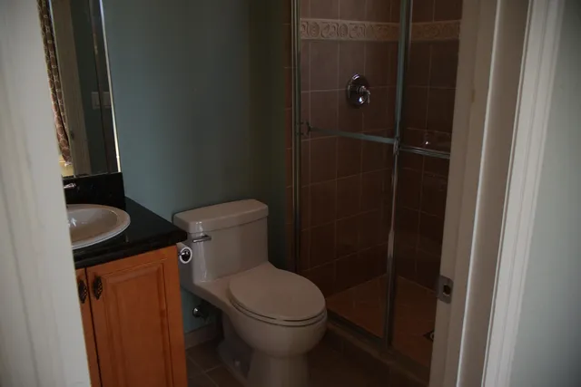 a view of a bathroom with a window and a white door