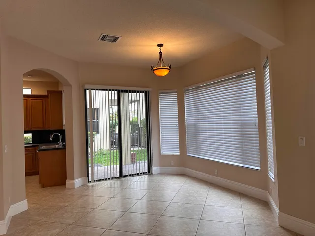 a view of hallway with wooden floor