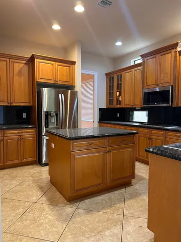 a view of an empty room and a window