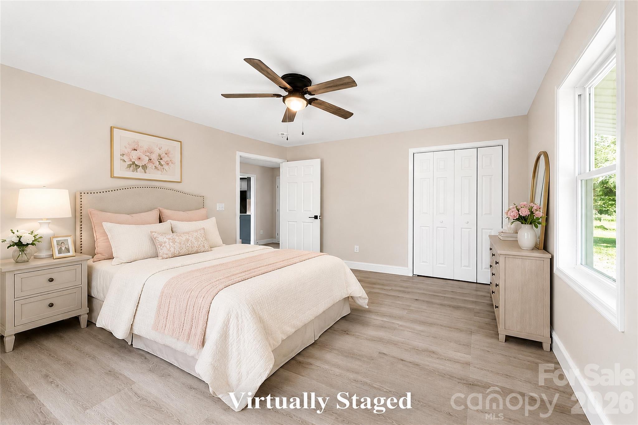 1403 Dudley Shoals Road Granite Falls, NC 28630 - Photo 21 of 34 a spacious bedroom with a bed and a window