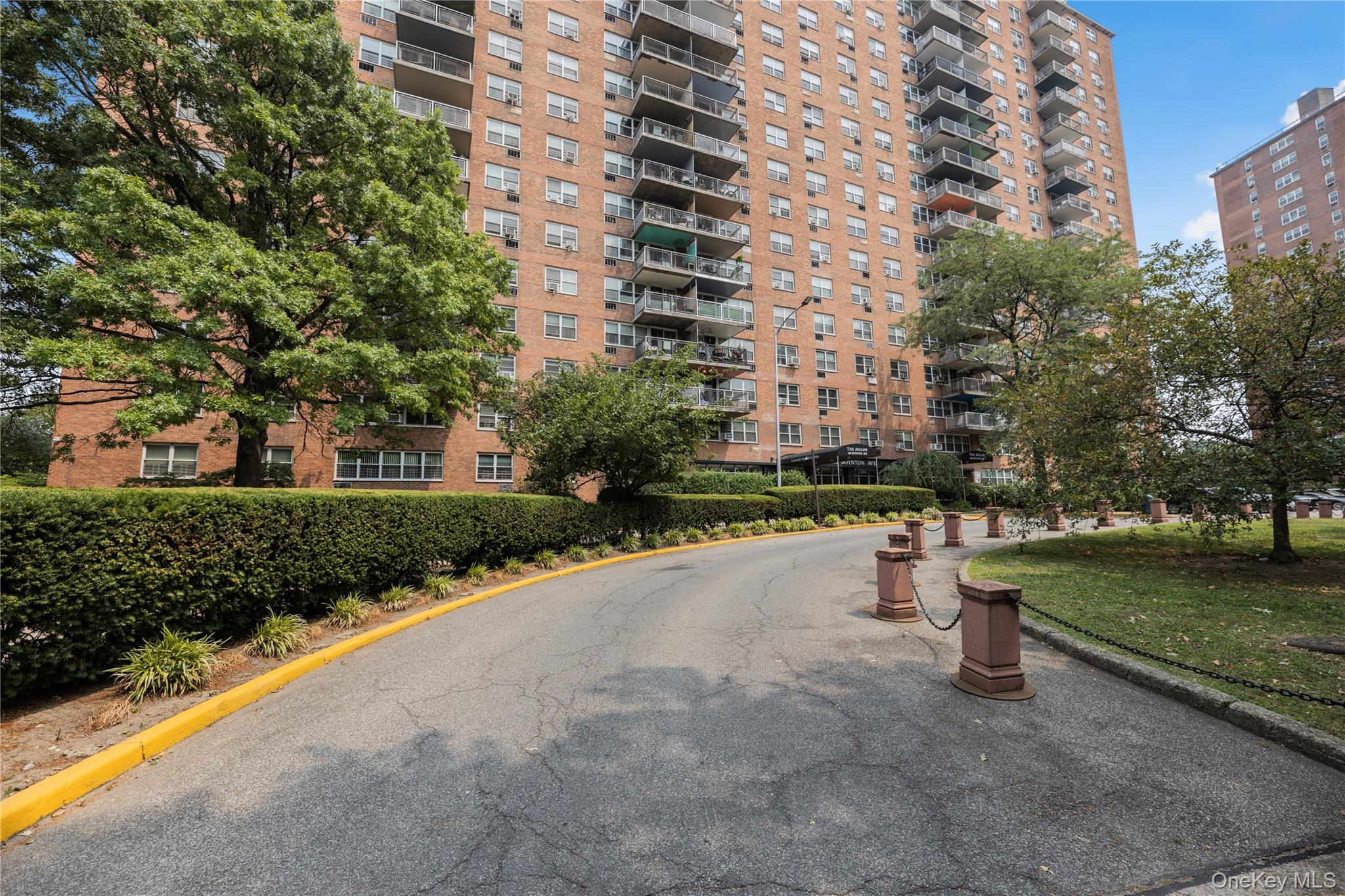 880 Boynton Avenue, Unit 13L Bronx, NY 10473 - Photo 14 of 19 a view of a street with a building and trees in the background