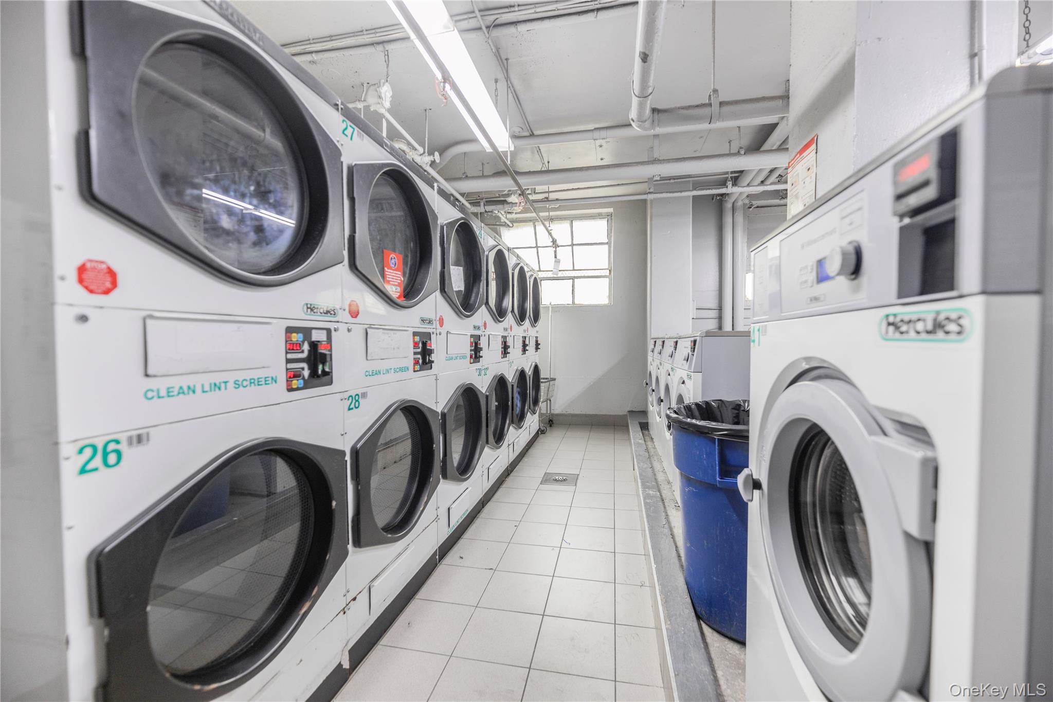 880 Boynton Avenue, Unit 13L Bronx, NY 10473 - Photo 10 of 19 a utility room with dryer and washer