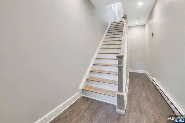 a view of entryway with wooden floor