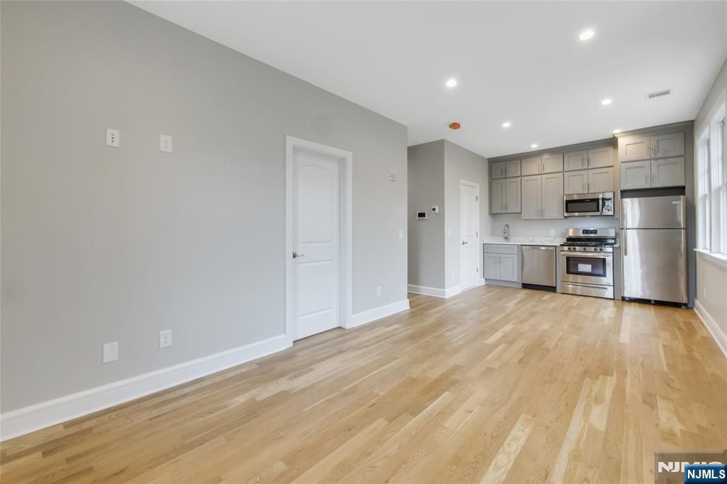 7 Hawthorne Avenue, Unit 7A Park Ridge, NJ 07656 - Photo 5 of 13 a view of kitchen with refrigerator microwave and stove