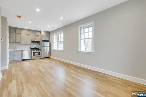 a view of kitchen and windows