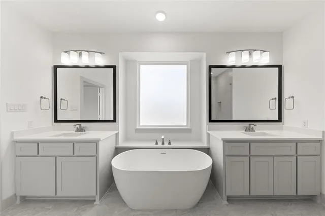 a bath room with a sink and a mirror