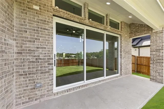 a view of a brick house with a large window