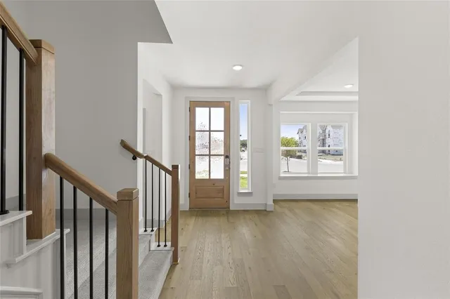 a view of an entryway with wooden floor