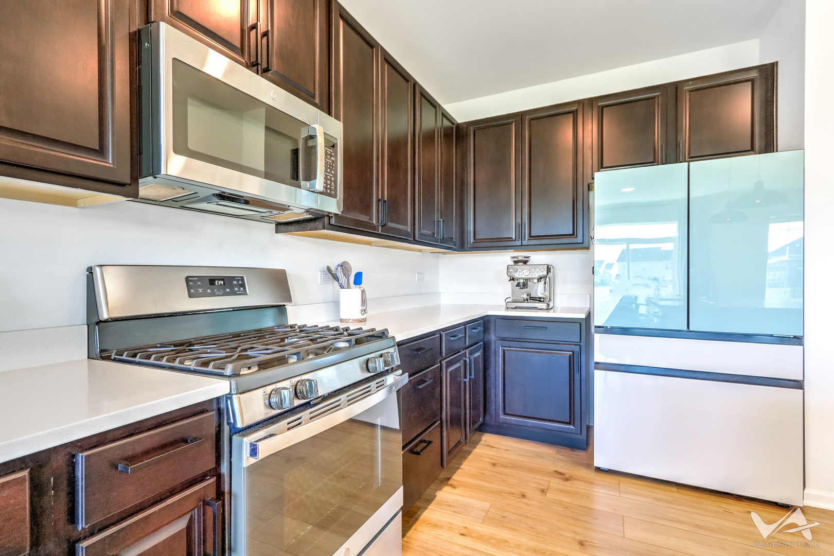 1828 Coralito Lane Elgin, IL 60124 - Photo 17 of 65 a kitchen with stainless steel appliances granite countertop a stove a sink and a microwave