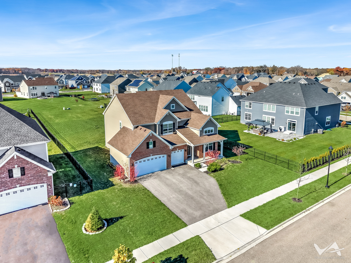 1828 Coralito Lane Elgin, IL 60124 - Photo 2 of 65 an aerial view of a house with a garden and trees