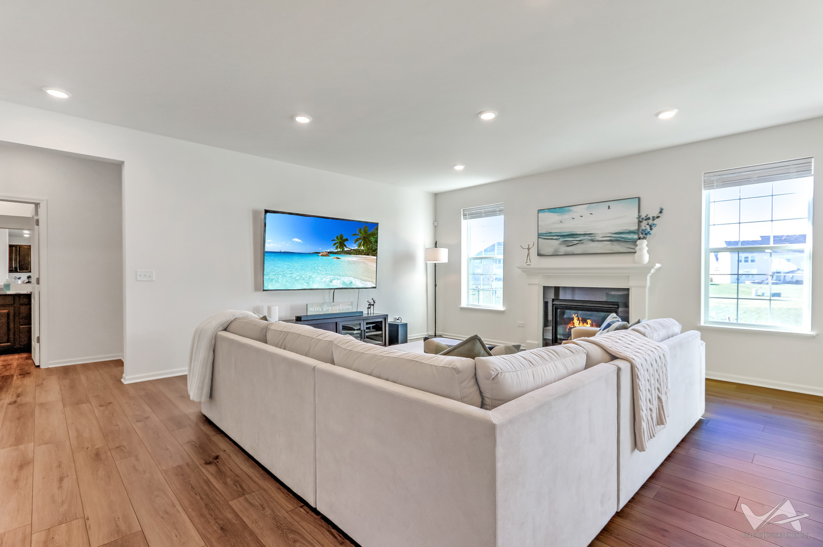 1828 Coralito Lane Elgin, IL 60124 - Photo 21 of 65 a living room with furniture a fireplace and a flat screen tv