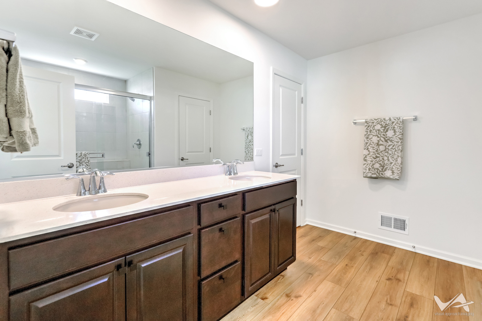 1828 Coralito Lane Elgin, IL 60124 - Photo 30 of 65 a bathroom with a double vanity sink and a mirror