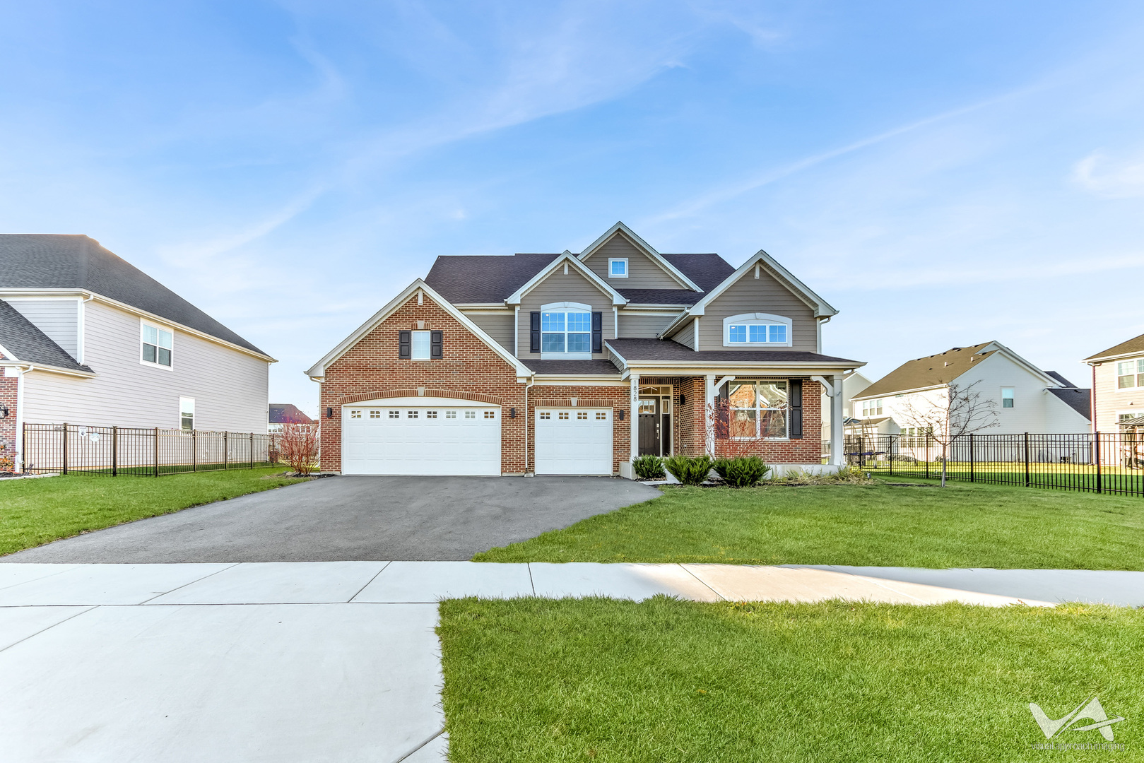 1828 Coralito Lane Elgin, IL 60124 - Photo 48 of 65 a front view of a house with a yard and garage