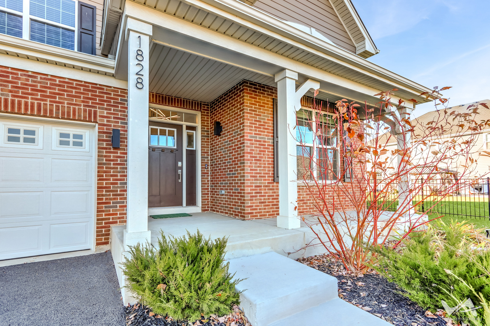 1828 Coralito Lane Elgin, IL 60124 - Photo 6 of 65 a front view of a house with a yard
