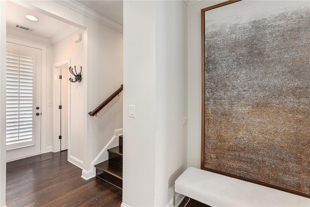 1438 Druid Manor Boulevard Atlanta, GA 30329 - Photo 13 of 31 a view of a hallway with wooden floor and staircase