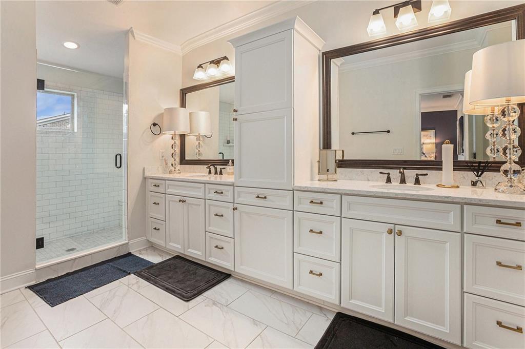 1438 Druid Manor Boulevard Atlanta, GA 30329 - Photo 18 of 31 a spacious bathroom with a double vanity sink a mirror and shower