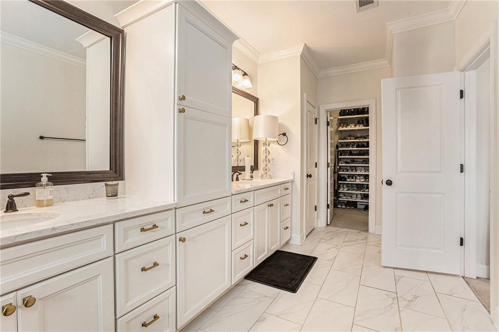 1438 Druid Manor Boulevard Atlanta, GA 30329 - Photo 19 of 31 a spacious bathroom with double vanity and mirrors