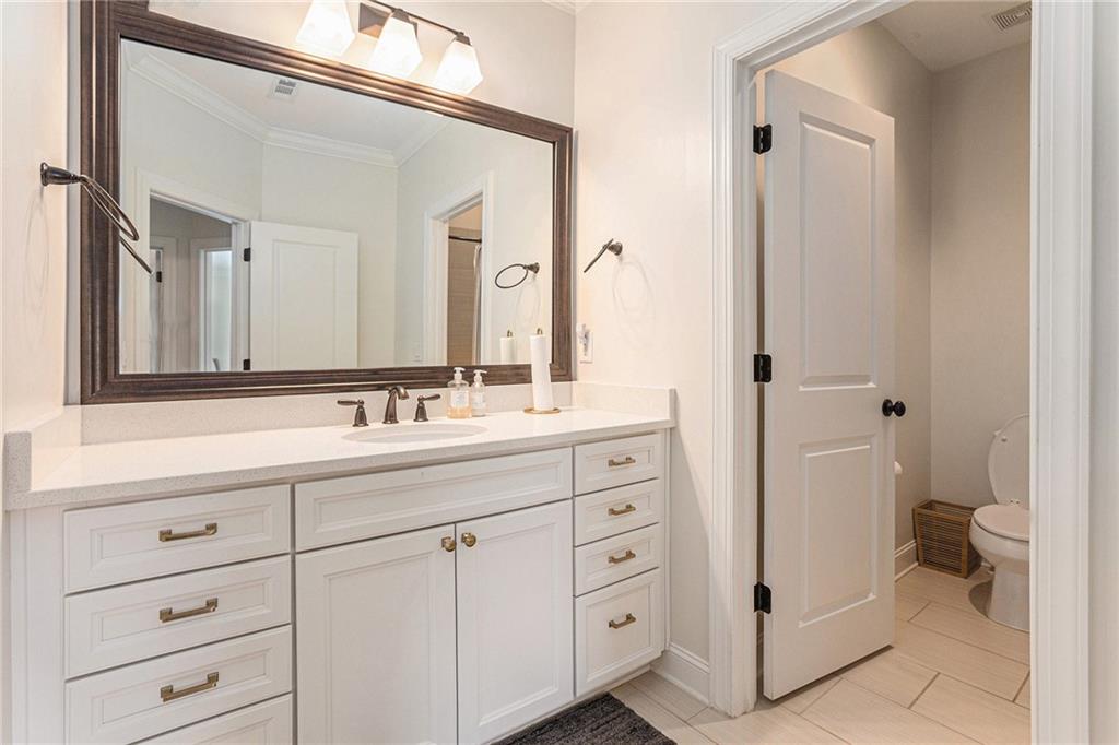 1438 Druid Manor Boulevard Atlanta, GA 30329 - Photo 21 of 31 a bathroom with a double vanity sink toilet and shower