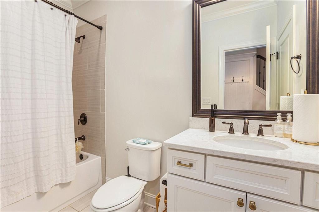1438 Druid Manor Boulevard Atlanta, GA 30329 - Photo 24 of 31 a bathroom with a sink toilet and shower