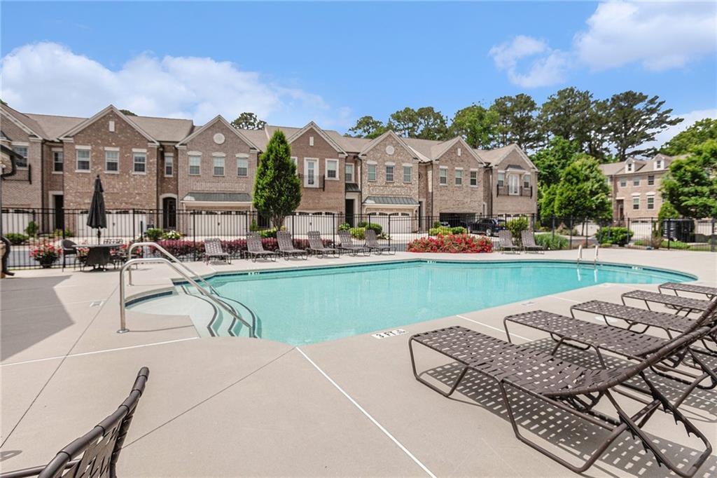 1438 Druid Manor Boulevard Atlanta, GA 30329 - Photo 29 of 31 a swimming pool with outdoor seating and yard