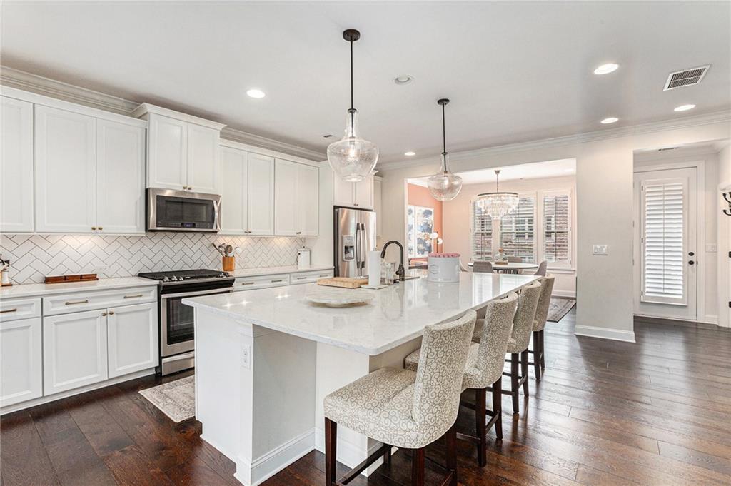 1438 Druid Manor Boulevard Atlanta, GA 30329 - Photo 4 of 31 a kitchen with appliances a sink and cabinets