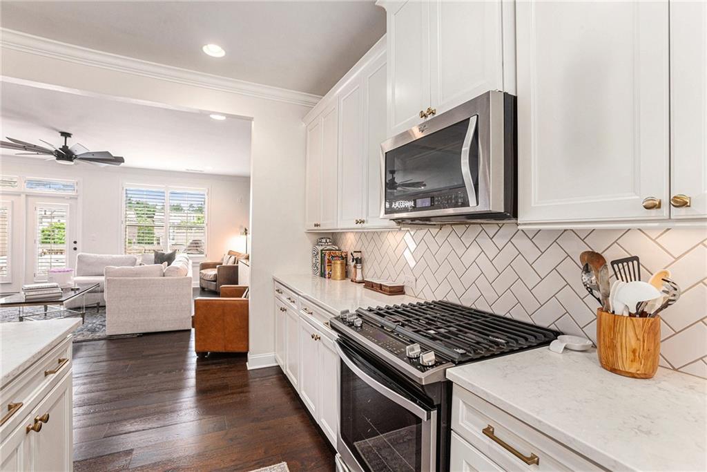 1438 Druid Manor Boulevard Atlanta, GA 30329 - Photo 7 of 31 a kitchen with sink stove and cabinets