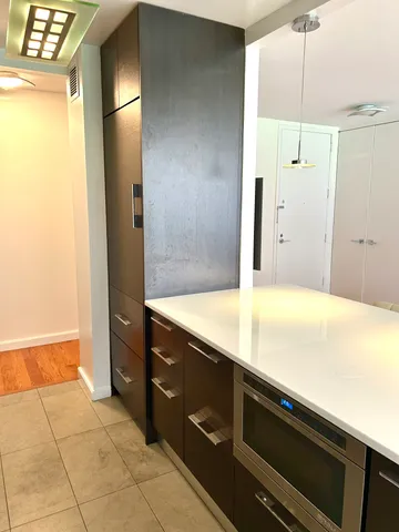 a room with a cabinet and a sink