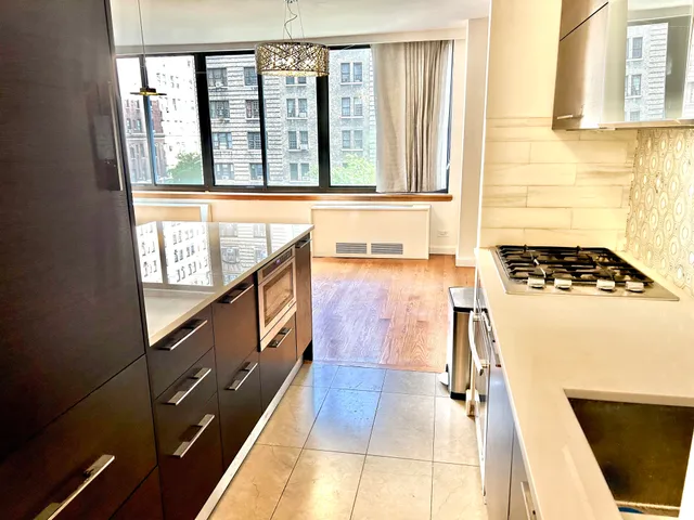 a view of a bathroom with a sink and a window