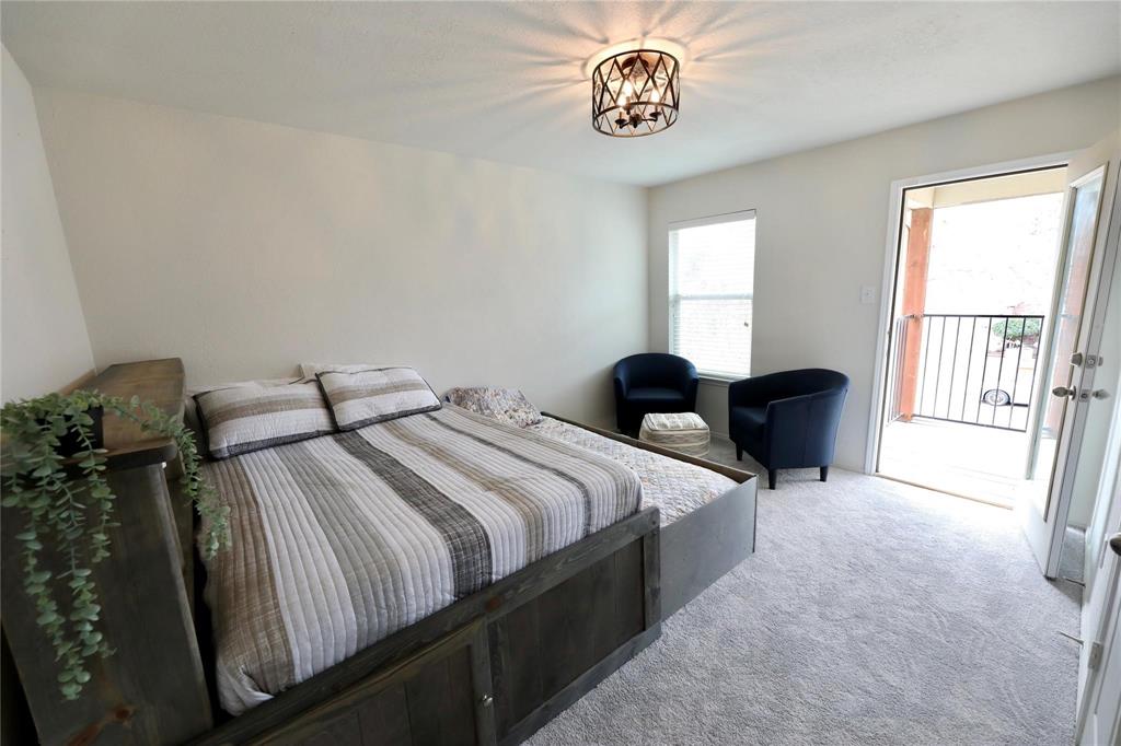 8404 Timberbrook Lane Dallas, TX 75249 - Photo 11 of 32 a bedroom with bed and a window
