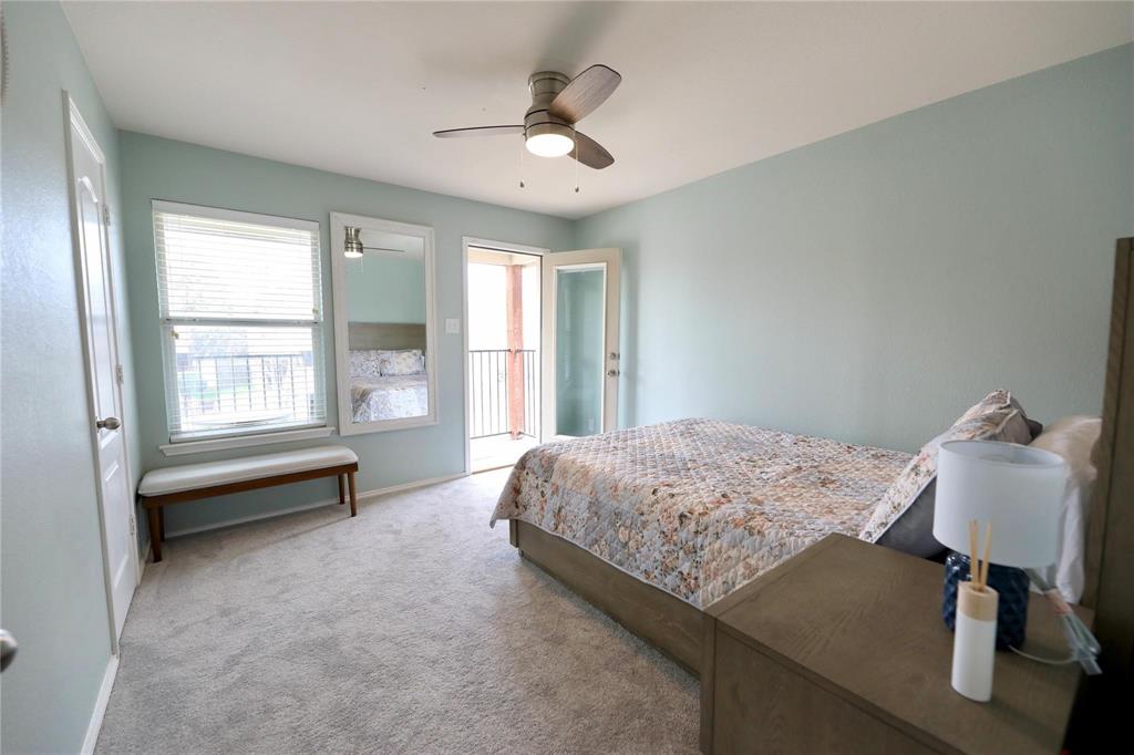 8404 Timberbrook Lane Dallas, TX 75249 - Photo 15 of 32 a bedroom with a bed and a window