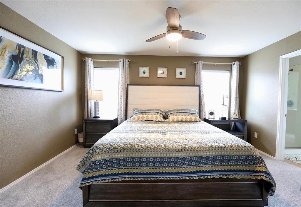 8404 Timberbrook Lane Dallas, TX 75249 - Photo 17 of 32 a bedroom with bed and window