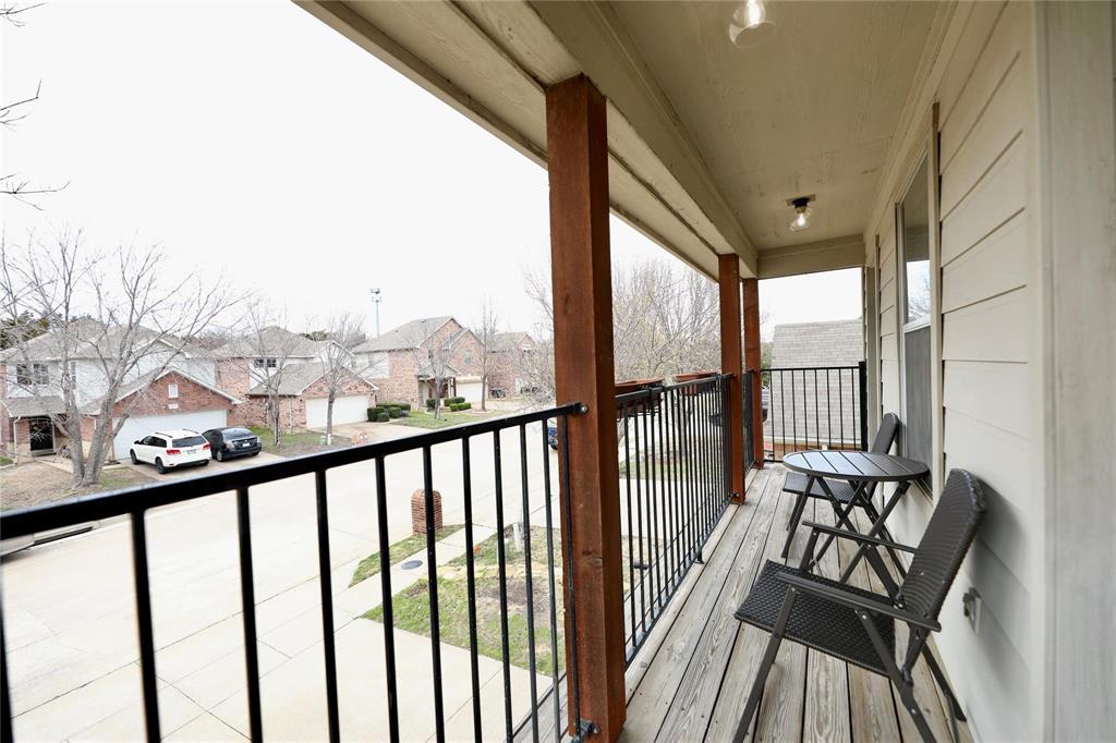 8404 Timberbrook Lane Dallas, TX 75249 - Photo 25 of 32 a view of a city from a balcony with furniture