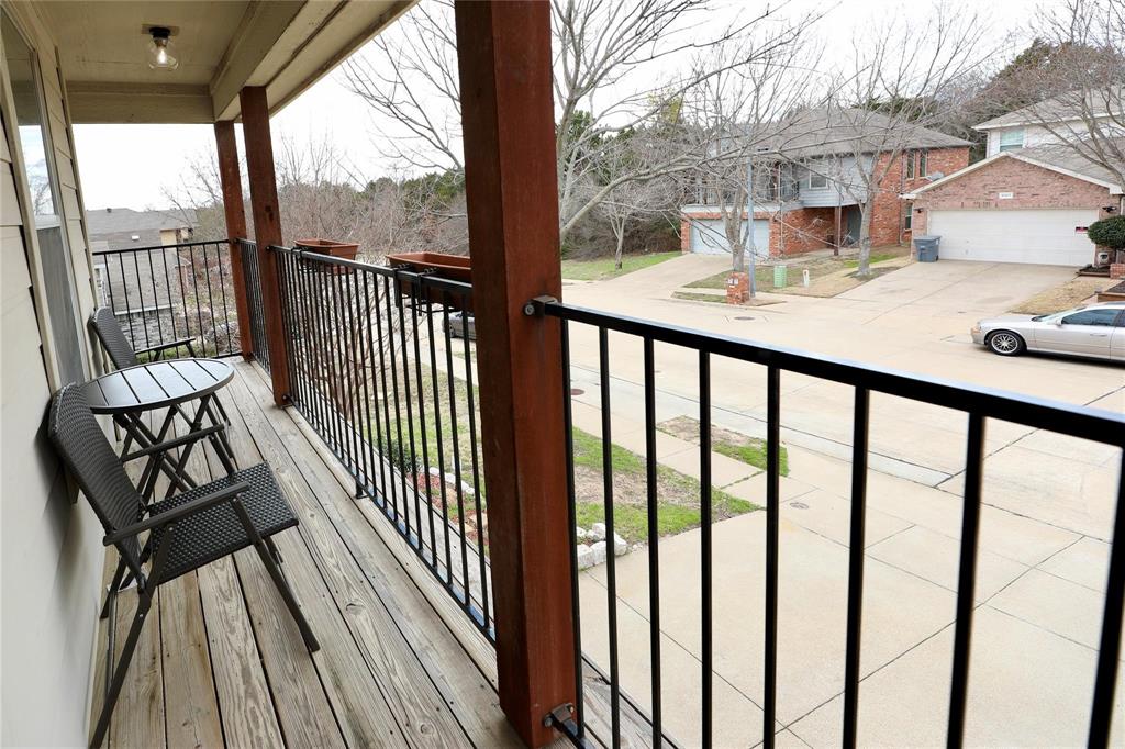 8404 Timberbrook Lane Dallas, TX 75249 - Photo 26 of 32 a view of a balcony with wooden floor