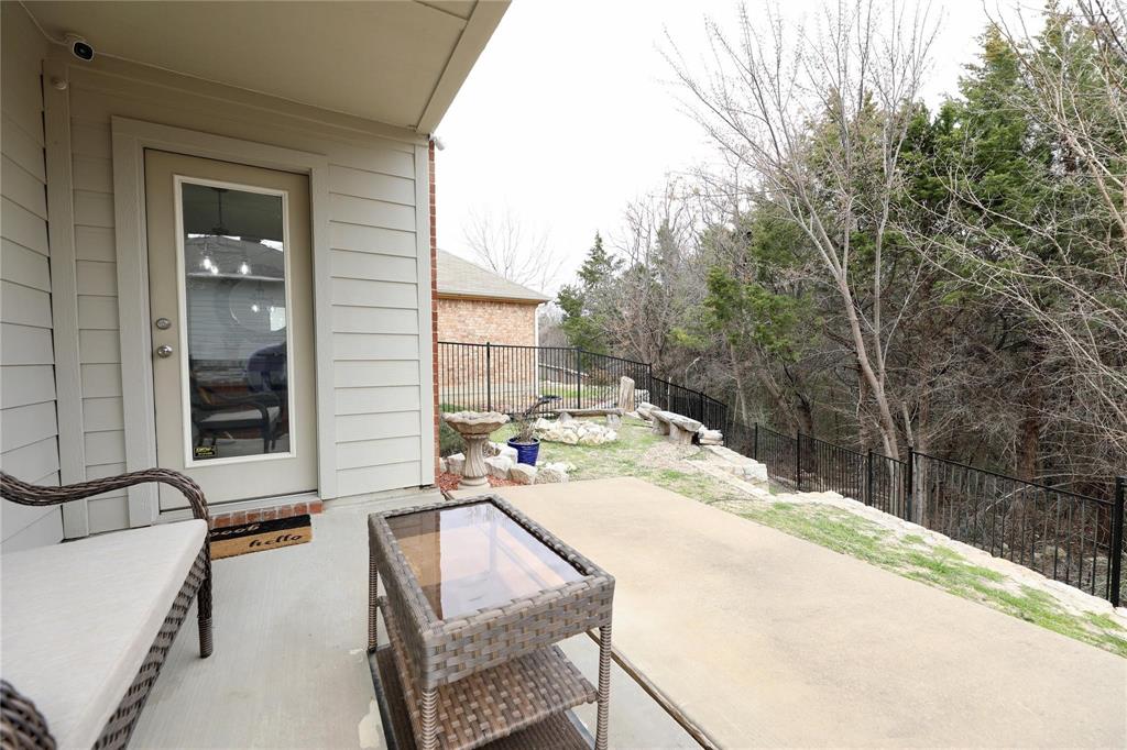 8404 Timberbrook Lane Dallas, TX 75249 - Photo 27 of 32 a view of a house with backyard and sitting area