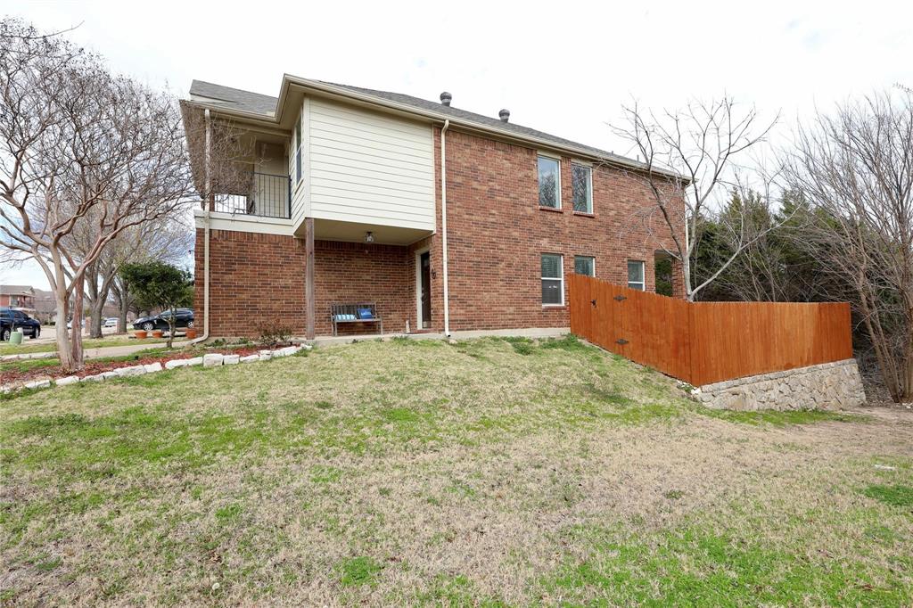 8404 Timberbrook Lane Dallas, TX 75249 - Photo 28 of 32 a view of a house with a yard