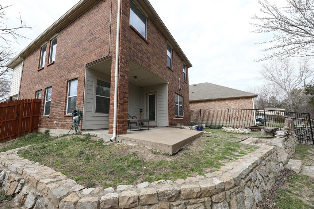 8404 Timberbrook Lane Dallas, TX 75249 - Photo 30 of 32 a view of a house with a yard and pathway