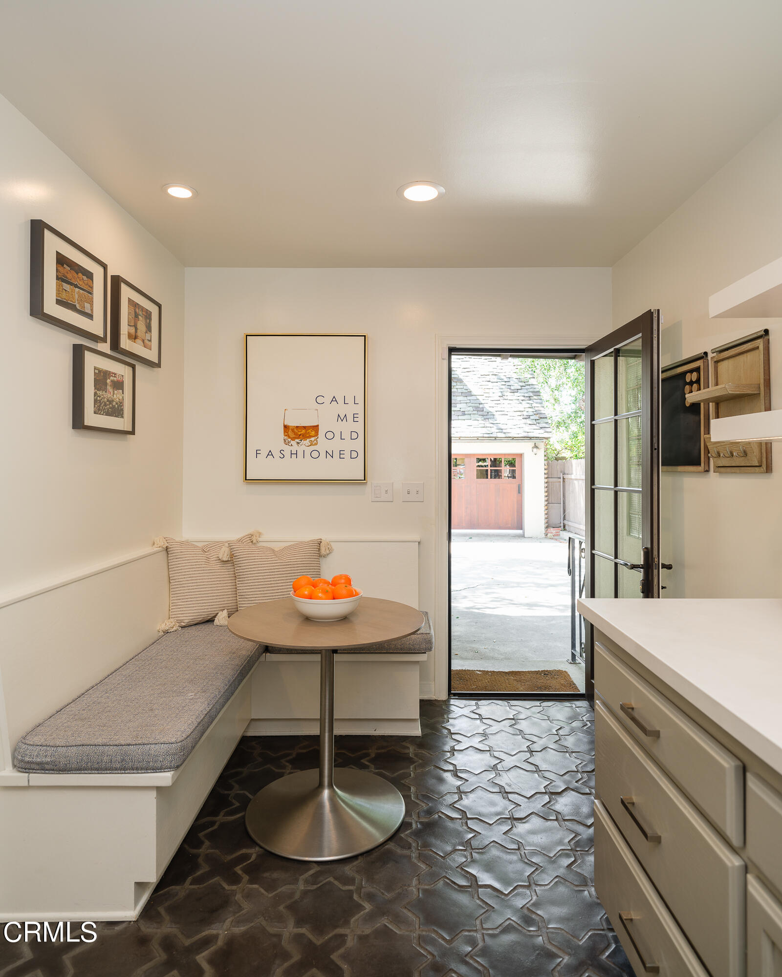 2295 Norwic Place Altadena, CA 91001 - Photo 17 of 60 a living room with a table and paintings on the wall