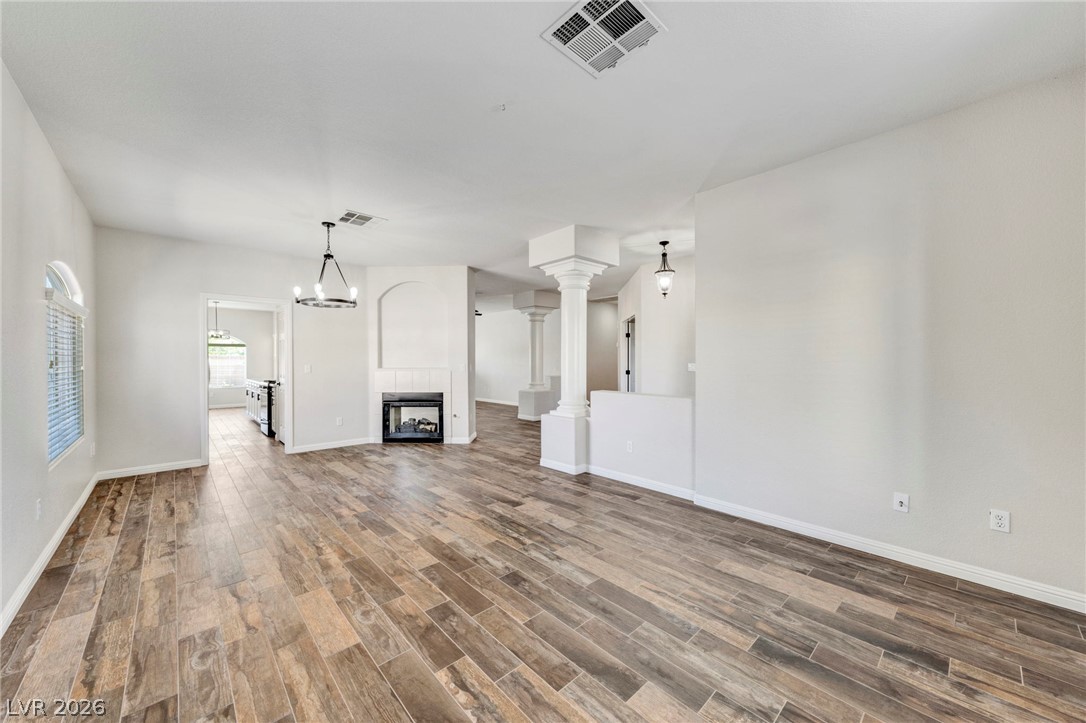 740 Aldo Rae Court, Unit NONE Henderson, NV 89052 - Photo 6 of 35 Natural wood-look flooring creates a warm, inviting ambiance in this expansive living area.